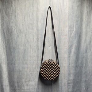 Lionel Chevron Patterned round Crossbody Bag